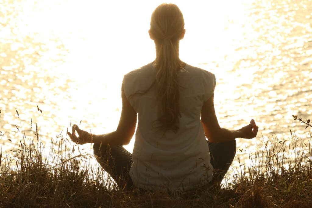 a woman do peacefully meditation for self reflection