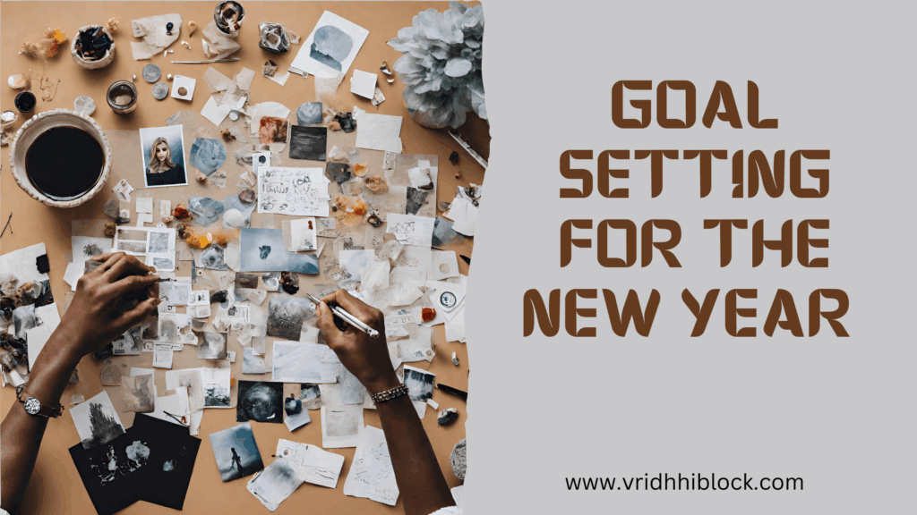 Person creating vision board for new year goals with photos and inspiration materials on desk